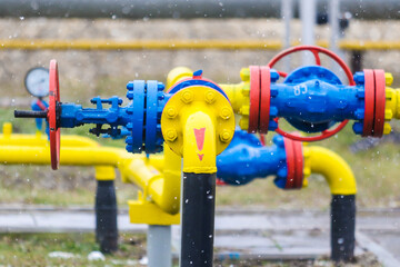 Yellow and blue pipes for pumping gas in winter