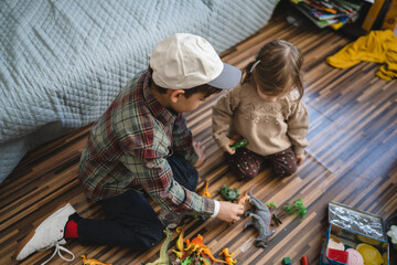 siblings brother and sister boy and girl children toddler play at home
