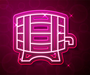 Glowing neon line Wooden barrel on rack with stopcock icon isolated on red background. Vector