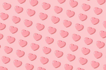Valentines day creative pattern with baby pink hearts on pastel pink background. 80s or 90s retro fashion aesthetic love concept. Minimal romantic idea.