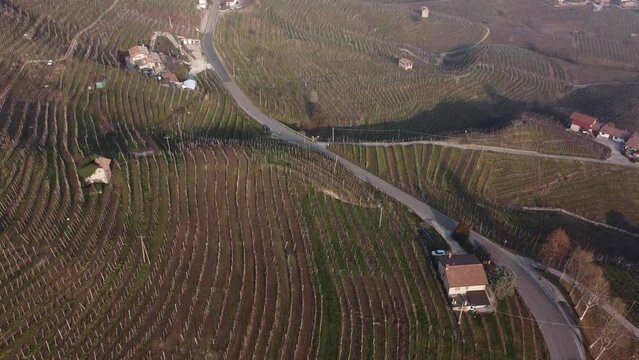 Aerial shot of the Unesco proseco hills, wine mountains framed by the Venetian fog.
Cold and foggy winter.