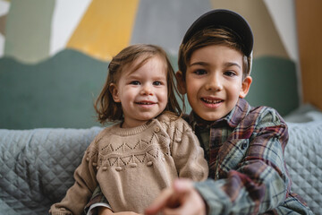 siblings portrait caucasian boy and girl brother and sister at home