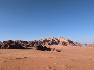 Fototapeta na wymiar Wadi Rum Desert, Jordan. The red desert and Jabal Al Qattar mountain.Where some famous movies where shot,Star Wars,Lawrence of Arabia. 