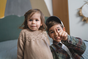siblings portrait caucasian boy and girl brother and sister at home