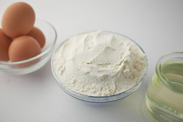 wheat flour in a bowl on table 