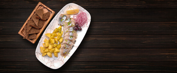 Sliced herring fillet with potatoes and onions