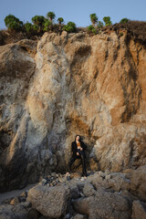 Model standing near the rock. Mika Nakano