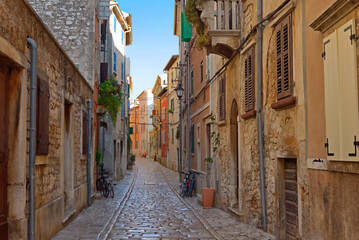 Streets of Rovinj with calm, colorful building facades, Istria, Rovinj is a tourist destination on Adriatic coast of Croatia - 568181340