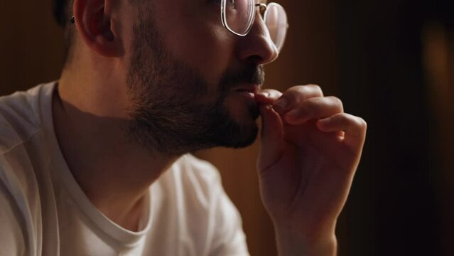 Close up bearded man clean teeth from food stuck her teeth with toothpick