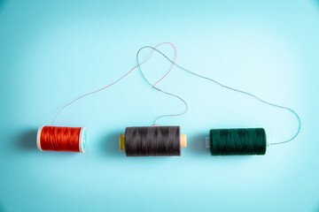 sewing thread rolls forming a heart shape out of the thread