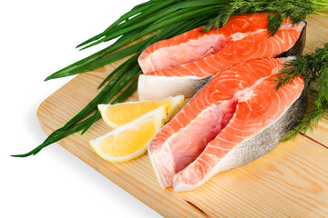 pieces of salmon and tuna fish on wooden plate isolated on white background