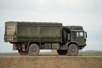 Fototapeta premium British army MAN SV 4x4 logistics lorry moving along a country track