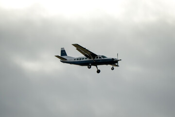 Fototapeta na wymiar a fixed wing light aircraft on descent to land 