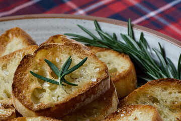 close up of toasted bread with coarse sea salt and rosemary