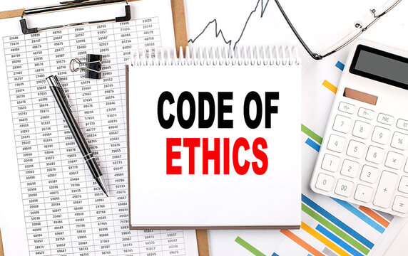 CODE OF ETHICS text on notebook with chart, calculator and pen