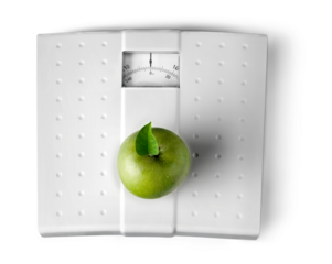 Green Apple on a Weight Scale