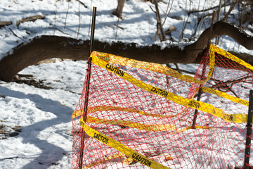 caution tape around excavation hole public works