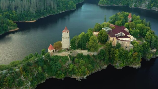 Turning around Zvikov Castle on the hill surrounded by river Vltava and Otava in South Bohemia region in Czech Republic, aerial view