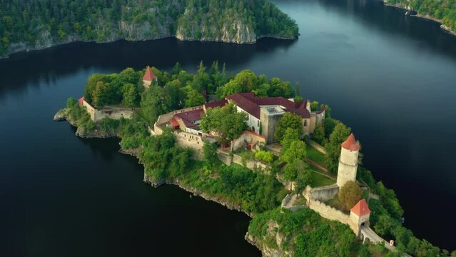  Top view of medieval Zvikov castle with traditional red roofs, river and forest in South Bohemia region in Czech Republic