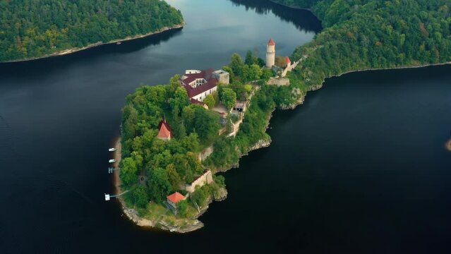 Aerial view of medieval Zvikov castle with traditional red roofs, river and forest in South Bohemia region in Czech Republic