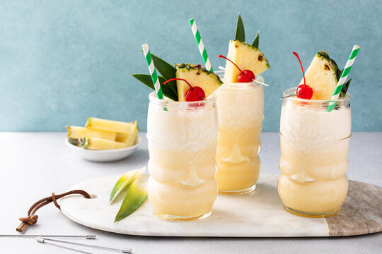Tropical pina colada cocktail or mocktail in a tiki glass