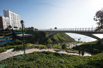 Fototapeta premium The Villena Rey Bridge in Miraflores district in Lima, June 2018- luxury building and ocean pacific Peru. Panoramic view