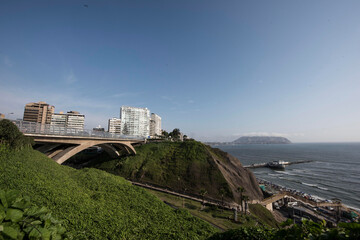Obraz premium The Villena Rey Bridge in Miraflores district in Lima, June 2018- luxury building and ocean pacific Peru. Panoramic view
