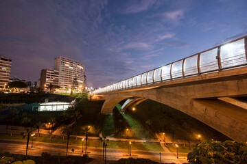 Fototapeta premium The Villena Rey Bridge in Miraflores district in Lima, June 2018- luxury building and ocean pacific Peru. Panoramic view