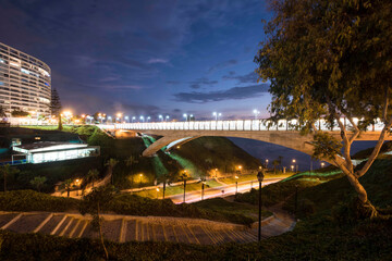 Fototapeta premium The Villena Rey Bridge in Miraflores district in Lima, June 2018- luxury building and ocean pacific Peru. Panoramic view