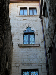 windows of the building at a narrow street in Split Croatia