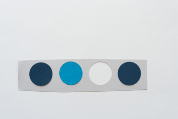 wide paper stripe with circle cutouts - three filled with paper discs