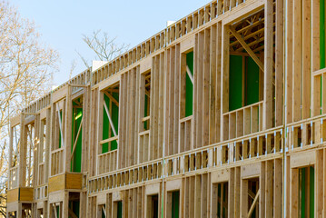 Fototapeta premium wooden framing for construction of new condominiums, apartments or townhomes