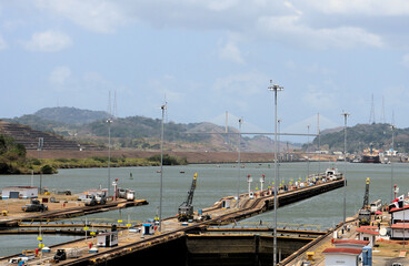 Ships sail through the Panama Canal, cargo ship escort