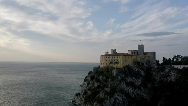 aerial drone shot of duino castle near trieste italy