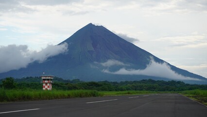 Runway of the airfield on the Ometepe Island, Nicaragua. In the background the country's symbol- La Concepción volcano can be seen.
