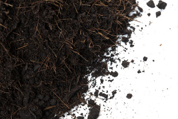 Black Fertilize Soil ready to planting, good organic soils with root for garden farming, pile set texture detail of soil with roots dust dirty.  close up selective focus over White background Isolated