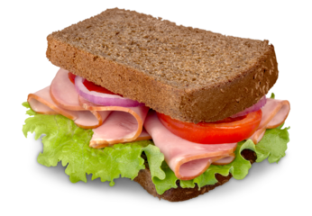 Ham sandwich on brown bread with tomatoes and salad.