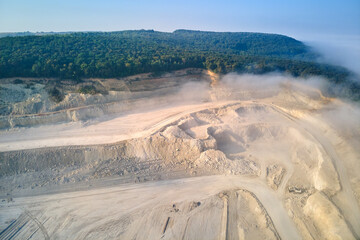 Aerial view of open pit mining site of limestone materials extraction for construction industry...