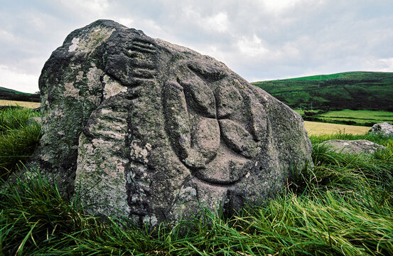 Cross of arcs and ogham writing. Early Celtic Christian stone. Maumanorig enclosure at Kilcolman near Ventry, Co. Kerry, Ireland
