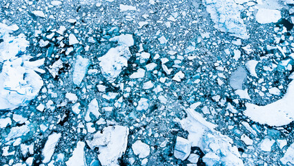 Melting Arctic Ice in Ocean Water, Blue Glacier Ice with Snow in Iceland. Climate Crisis