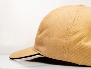 Brown baseball hat on a white background