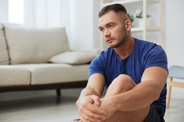 Man sportsman training at home, push-up exercises for arm, leg and back muscles, strong body and correct posture, the concept of health and beauty