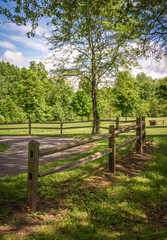 Rural Roughcut Wood Fencing surrounding yard Driveway