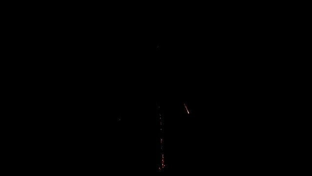 Explosion of bright colorful part of fireworks on black background to create a set salute on video for holiday new year, birthday, wedding or other celebration.