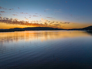 Pretty sunrise waterscape with low clouds