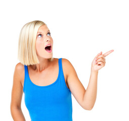 Fototapeta premium Shocked woman and pointing for space, product placement and discount girl isolated on white studio background. Young female, lady and gesture for choice, sales and advertising for deal and surprised