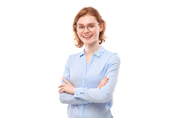 Portrait of attractive red-haired girl in business shirt and glasses smiling joyfully isolated on white studio background.