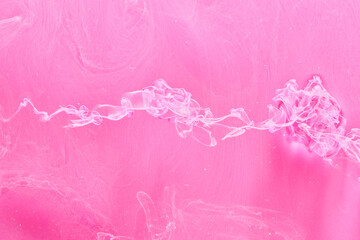 Gentle Pink abstract ocean background. Splashes, drops and waves of paint under water, clouds of smoke in motion