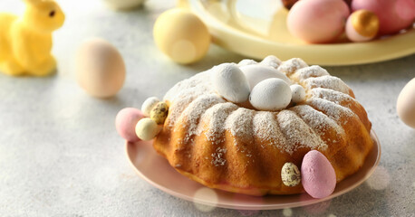 Plate with tasty Easter cake and painted eggs on table