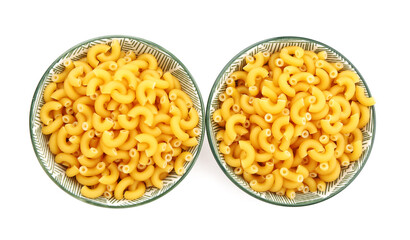 Bowls of raw elbow pasta on white background